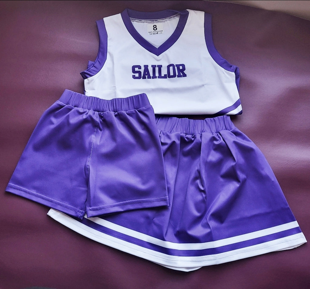 Custom color 3-piece cheer uniform: white top with purple trim, purple shorts and skirt, personalized name option.