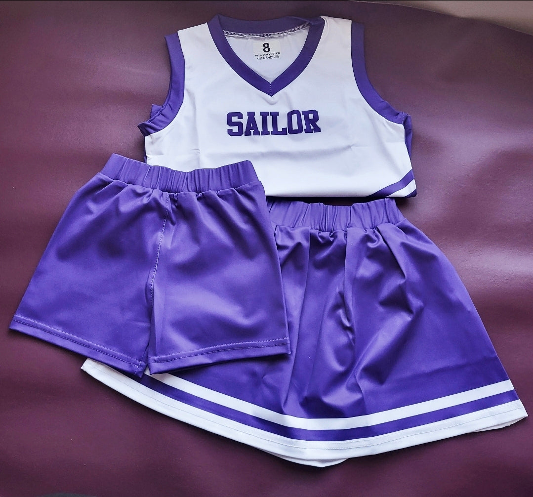 Custom color 3-piece cheer uniform: white top with purple trim, purple shorts and skirt, personalized name option.